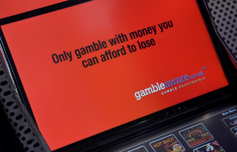 © Reuters. A campaign slogan is seen displayed on a gambling machine in a branch of Ladbrokes in central London, Britain