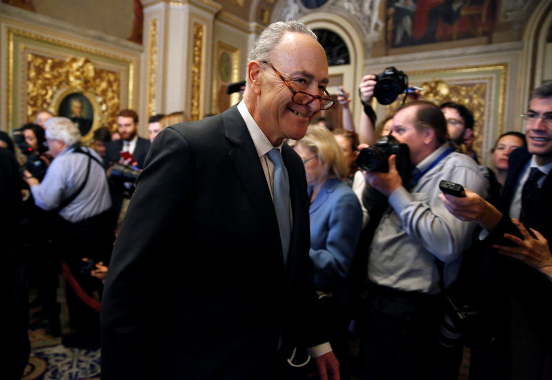 © Reuters. Senate Minority Leader Chuck Schumer (D-NY) walks from a Democratic caucus meeting during the third day of a shut down of the federal government in on Capitol Hill in Washington