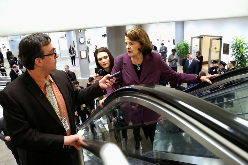 © Reuters. U.S. Senators arrive vote on a bill to renew the NSA's warrantless internet surveillance program, at the U.S. Capitol