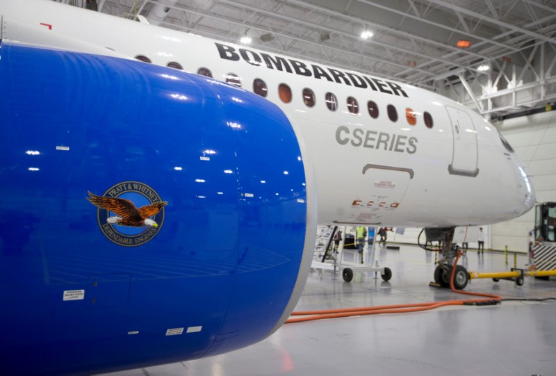 © Reuters. FILE PHOTO: Bombardier's CS300 Aircraft showing its Pratt & Whitney engine in the foreground sits in the hangar prior to its test flight in Mirabel