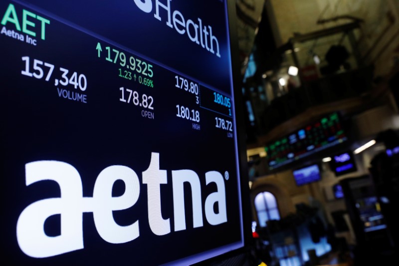 © Reuters. A logo of Aetna is displayed on a monitor above the floor of the New York Stock Exchange shortly after the opening bell in New York