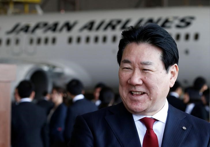 © Reuters. JAL Co's President Ueki speaks to the media after JAL group's initiation ceremony at a hangar of Haneda airport in Tokyo