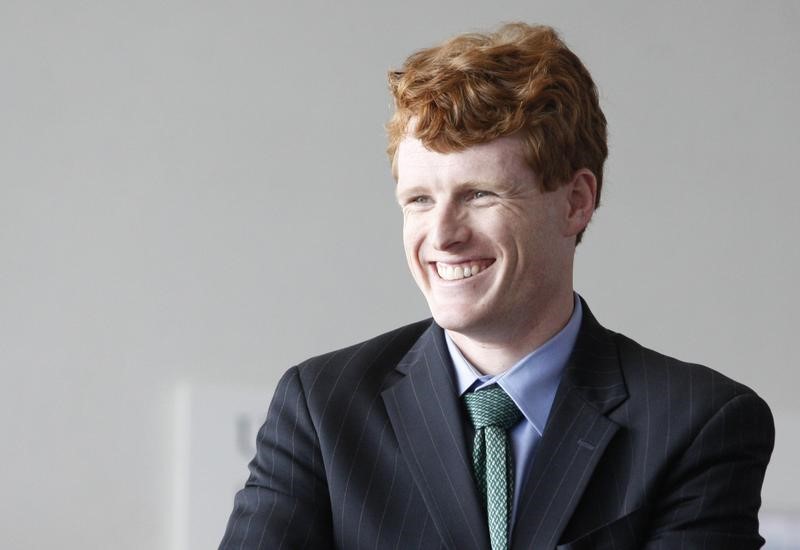 © Reuters. Massachusetts Congressional candidate Kennedy III laughs as he waits for Prime Minister of Ireland Kenny to arrive at John F. Kennedy Presidential Library and Museum in Boston