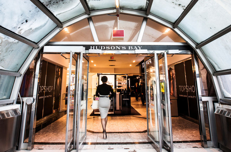 © Reuters. FILE PHOTO: A man walks through the doors at the Hudson's Bay Company (HBC) flagship department store in Toronto