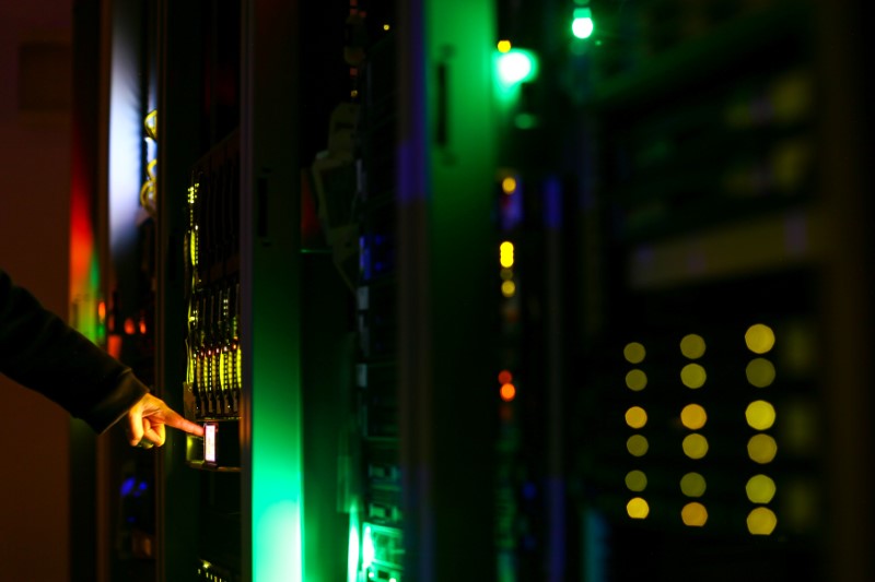 © Reuters. Illustration picture of man posing inside a server room at an IT company