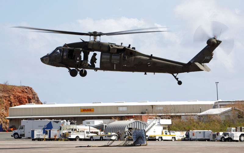 © Reuters. FILE PHOTO: A U.S. Army UH-60 Black Hawk helicopter rises after setting disaster relief supplies down on the tarmac at Cyril E. King Airport in Charlotte Amalie, St. Thomas, U.S. Virgin Islands