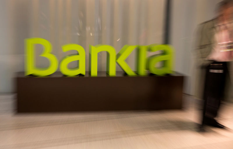 © Reuters. FILE PHOTO: Spain's Bankia logo is seen inside bank's headquarters before a news conference to present their annual results in Madrid