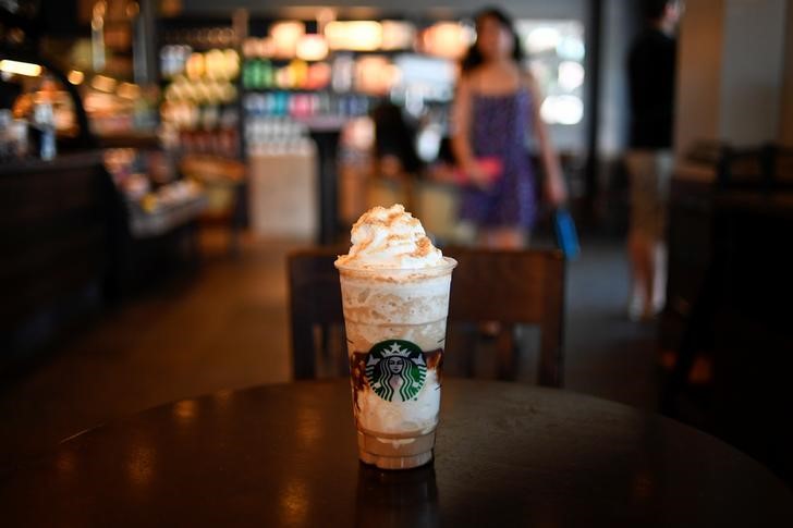 © Reuters. A S'mores Frappuccino Blended Coffee rests on a table at a Starbucks coffeehouse in Austin