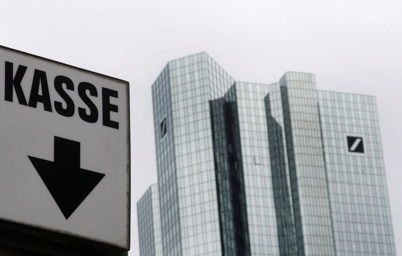 © Reuters. The cash desk sign of a nearby car park is pictured next to the head quarters of Germany's largest business bank, Deutsche Bank, in Frankfurt