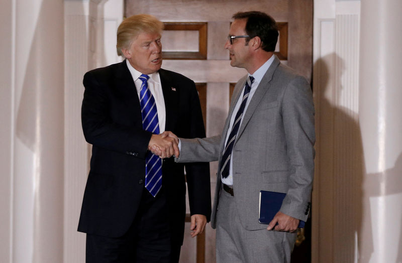 © Reuters. FILE PHOTO: U.S. President-elect Donald Trump stands with Todd Ricketts, co-owner of the MLB baseball team the Chicago Cubs, following their meeting at the main clubhouse at Trump National Golf Club in Bedminster