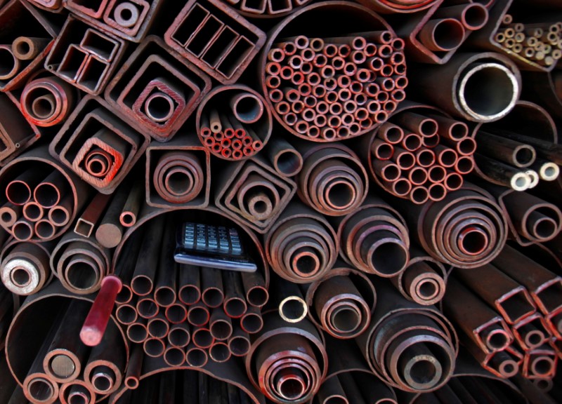 © Reuters. Pocket calculator is seen on steel products at a steel works in Seoul