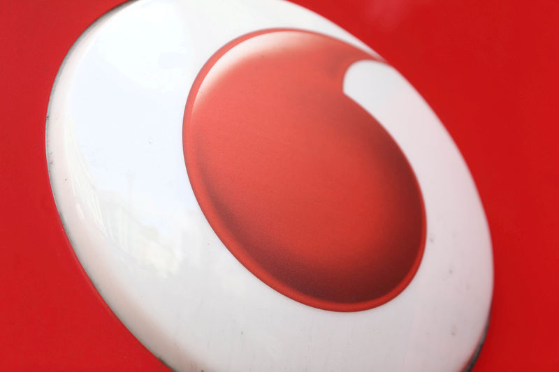 © Reuters. FILE PHOTO:A branded sign is displayed on a Vodafone store in London
