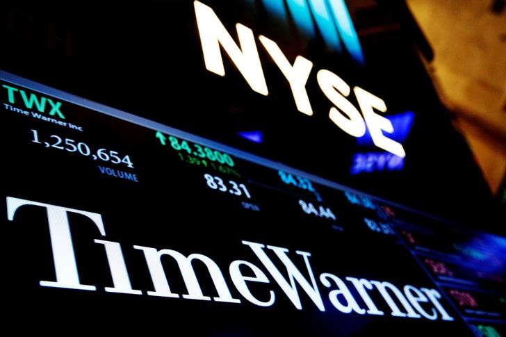 © Reuters. FILE PHOTO - Ticker and trading information for media conglomerate Time Warner Inc. is displayed at the post where it is traded on the floor of the New York Stock Exchange in New York City