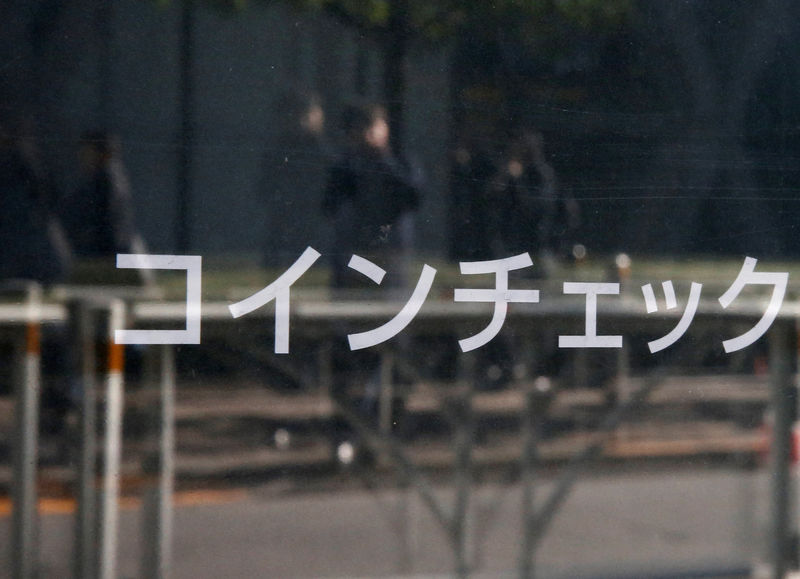 © Reuters. Cryptocurrency exchange Coincheck's signboard is pictured in front of a building where their office is located, in Tokyo