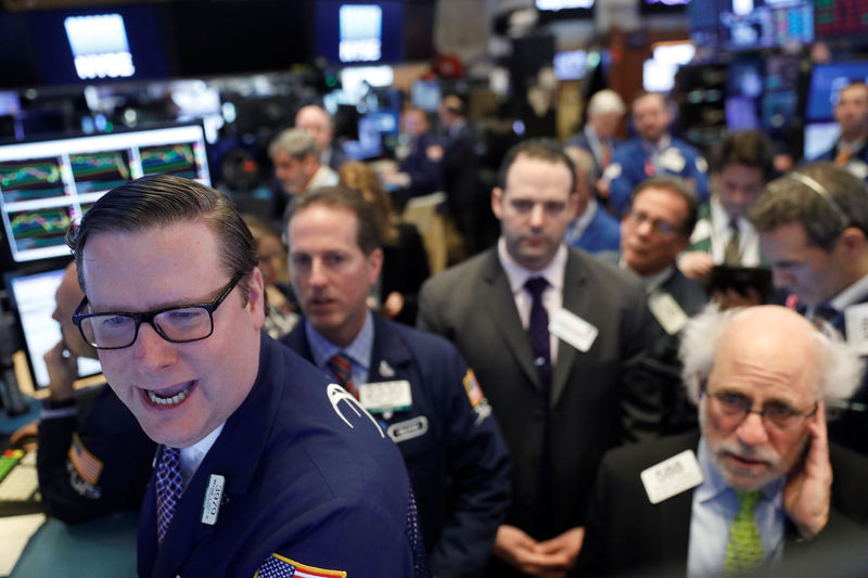 © Reuters. Traders work on the floor of the New York Stock Exchange shortly after the opening bell in New York