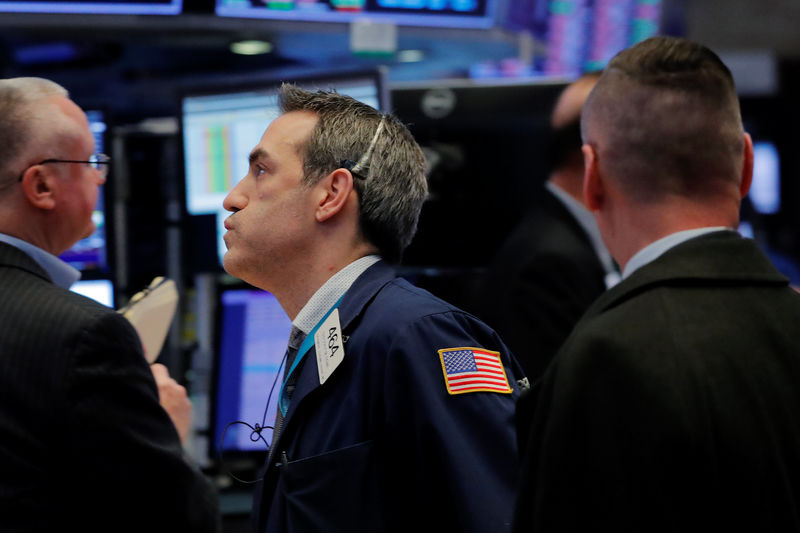 © Reuters. A trader works on the floor of the New York Stock Exchange shortly after the closing bell in New York