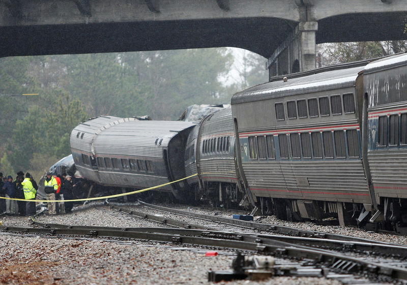 © Reuters. Emergency responders are at the scene after an Amtrak passenger train collided with a freight train and derailed in Cayce South Carolina