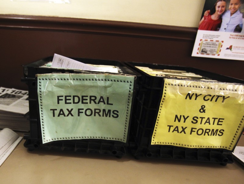 © Reuters. Crates filled with 2011 tax forms are seen at the 96th Street Public Library in New York