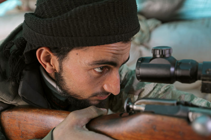 © Reuters. Turkey-backed Free Syrian Army fighter is seen at al Ajami village in east al Bab