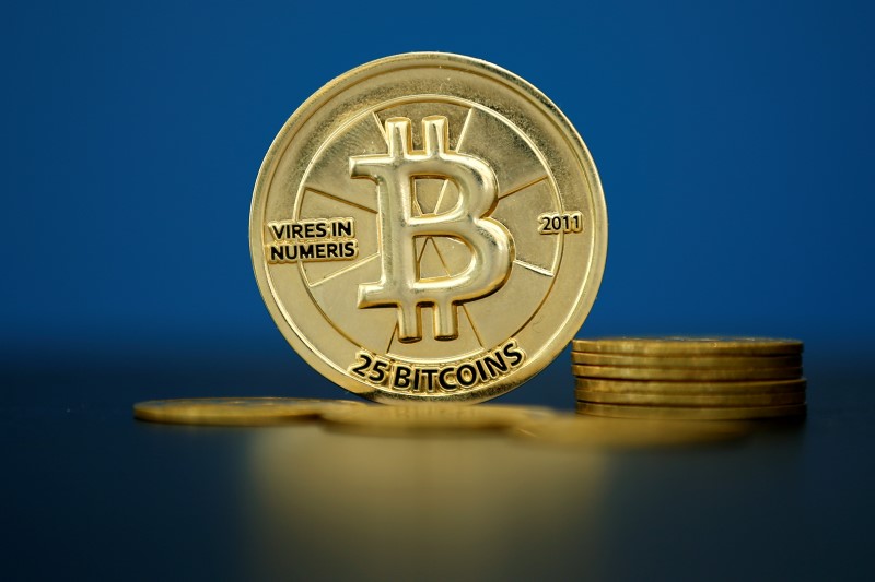 © Reuters. An illustration photo of Bitcoin (virtual currency) coins that are seen at La Maison du Bitcoin in Paris