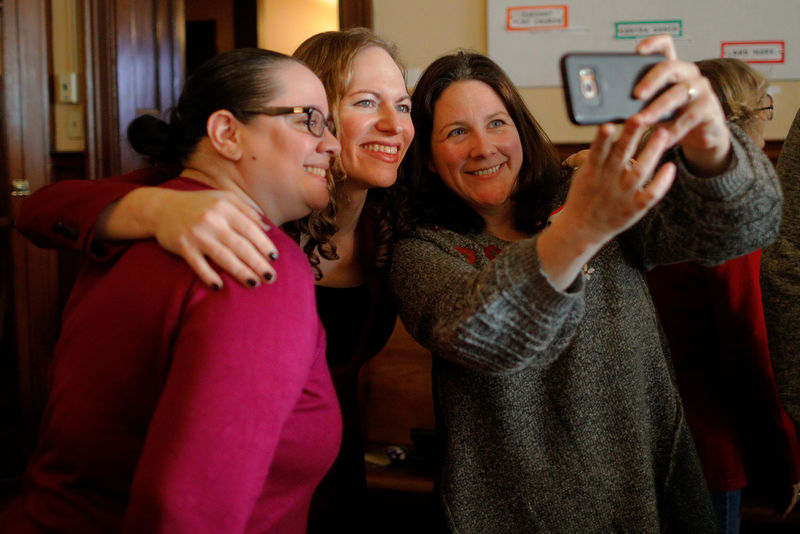 © Reuters. Democratic candidate for the U.S. Congress Alexandra Chandler poses for a selfie with voters after the Greater Haverhill Indivisible candidates forum in Haverhill