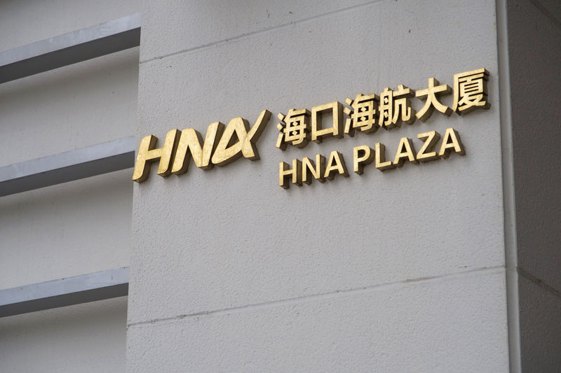 © Reuters. Sign of HNA Group Co Ltd is pictured at its headquarters in Haikou