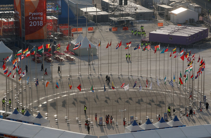 © Reuters. Flags of the participating countries of the Pyeongchang 2018 games fly on a square in Pyeongchang