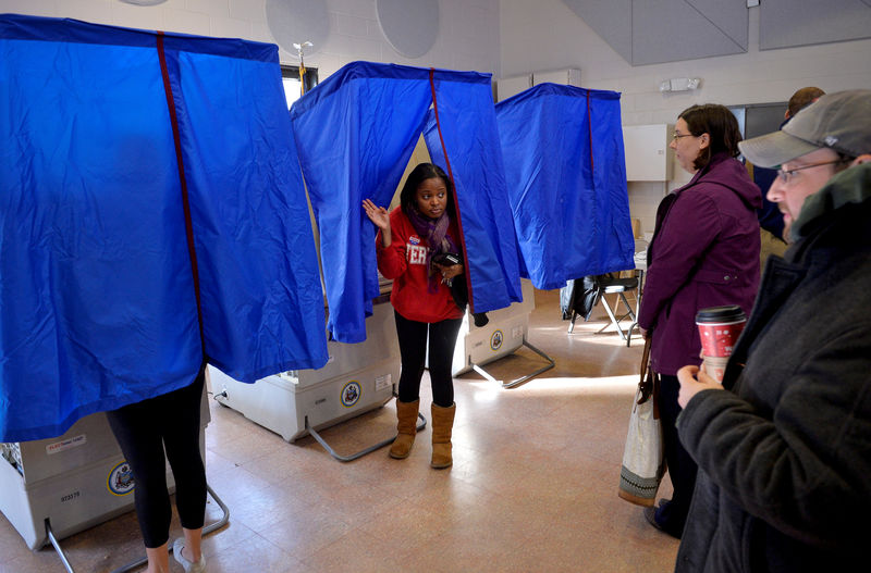 © Reuters. FILE PHOTO: A voter leaves the polling booth during the U.S. presidential election in Philadelphia