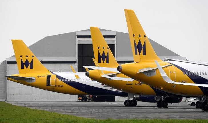 © Reuters. Monarch airplanes are parked on the runway after the airline went into administration at Newquay airport, Newquay