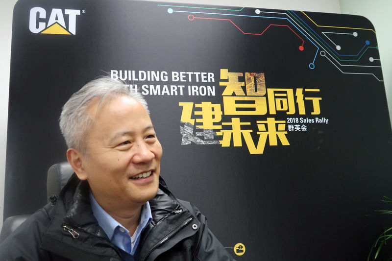 © Reuters. Chen Qihua, head of Caterpillar China, speaks to Reuters at a Caterpillar facility in Nantong