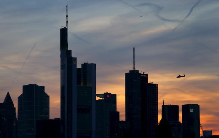 © Reuters. The famous skyline with its banking district is pictured as a rescue helicopter flies by in Frankfurt