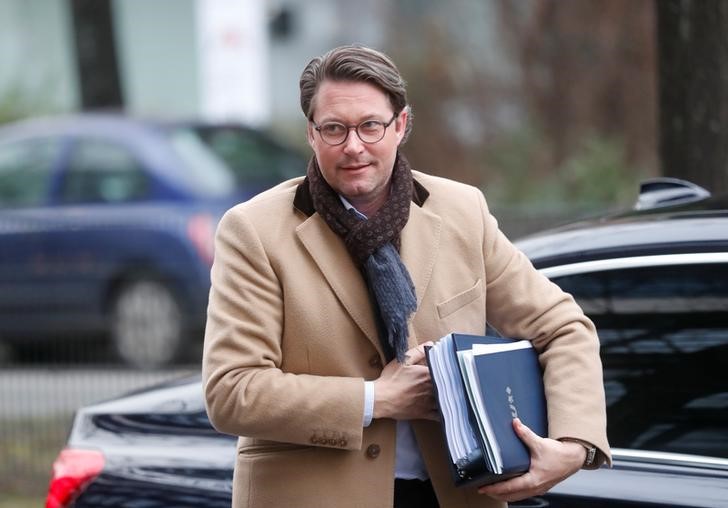 © Reuters. CSU Secretary General Scheuer arrives for exploratory talks about forming a new coalition government at the SPD headquarters in Berlin