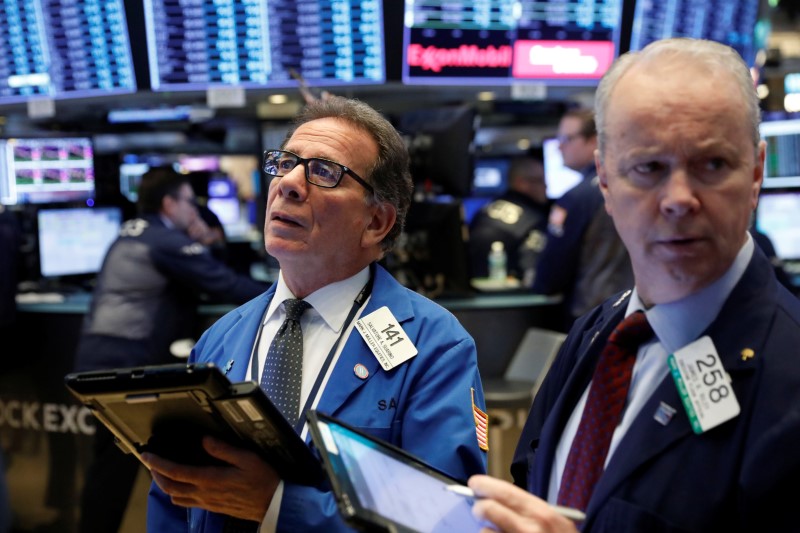 © Reuters. Traders work on the floor of the New York Stock Exchange shortly after the opening bell in New York