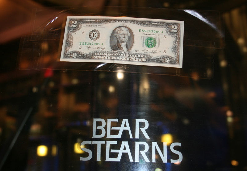 © Reuters. FILE PHOTO: A U.S. two dollar bill is taped to the revolving door leading to the Bear Stearns global headquarters in New York