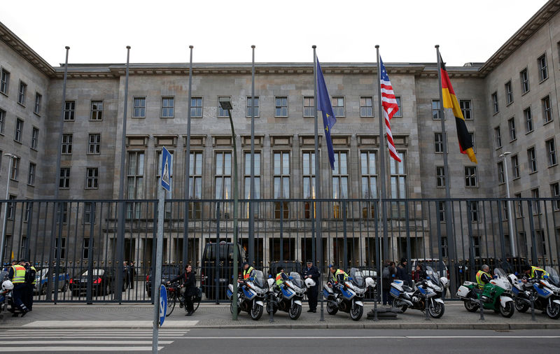 © Reuters. FILE PHOTO: Police wait outside the Finance Ministry in Berlin