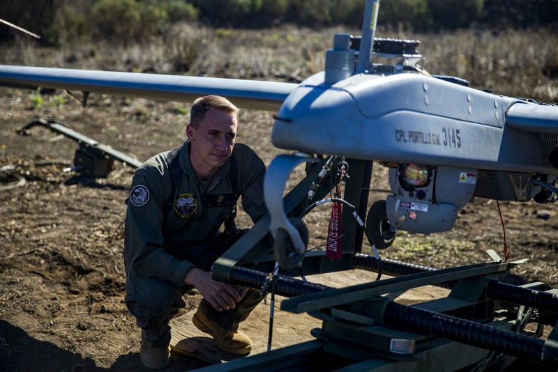 © Reuters. Handout photo of U.S. Marine Staff Sgt. James Smith inspecting an RQ-7B Shadow unmanned aerial vehicle during preflight checks at the Pohakuloa Training Area, on the island of Hawaii