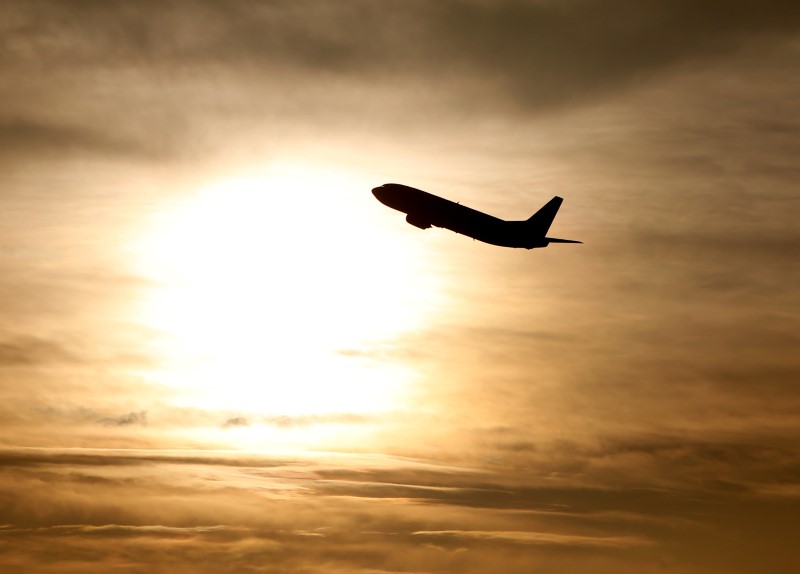 © Reuters. A plane is seen during sunrise at the international airport in Munich