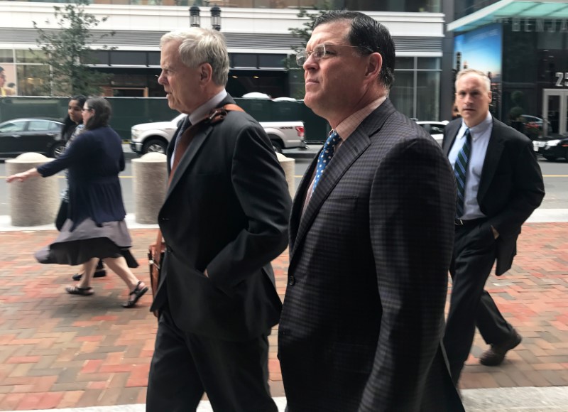 © Reuters. Former F-Squared Investments Inc CEO Howard Present (center), arrives at the federal court in Boston