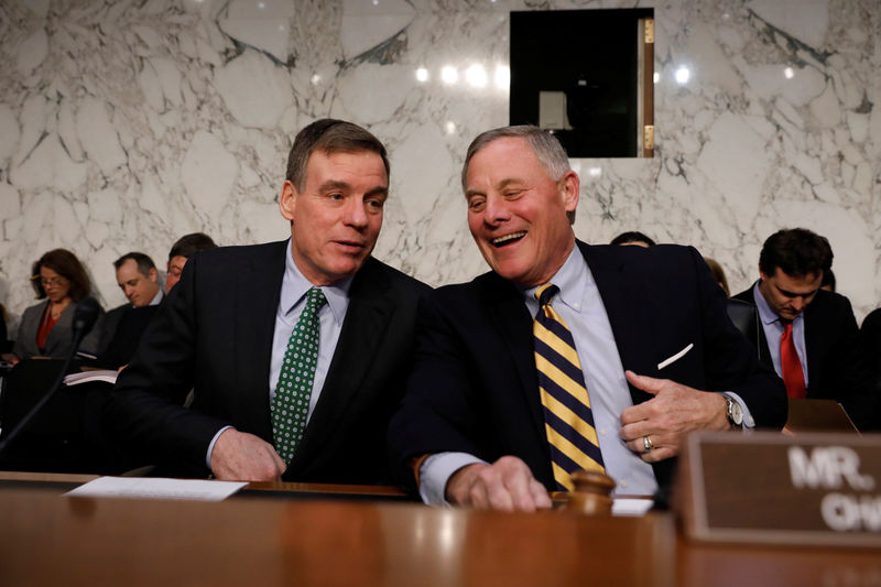 © Reuters. Sen. Mark Warner (D-VA) speaks with Sen. Richard Burr (D-NC), prior to a hearing of the Senate Intelligence Committee about election security on Capitol Hill in Washington