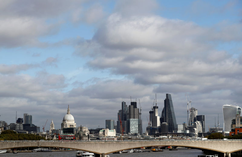 © Reuters. FILE PHOTO: Buildings in the City of London are seen behind Waterloo Bridge in London