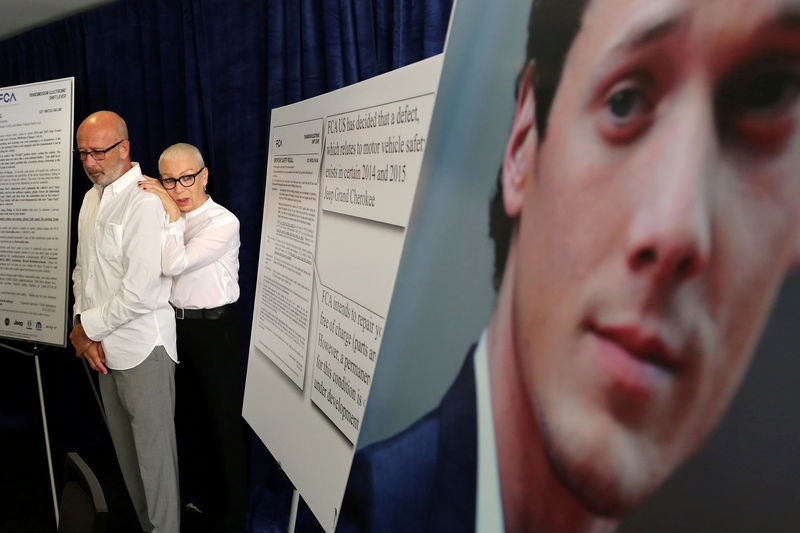 © Reuters. FILE PHOTO: Victor Yelchin and Irina Yelchina parents of "Star Trek'' actor Anton Yelchin stand near a portrait of their late son during a news conference in Los Angeles