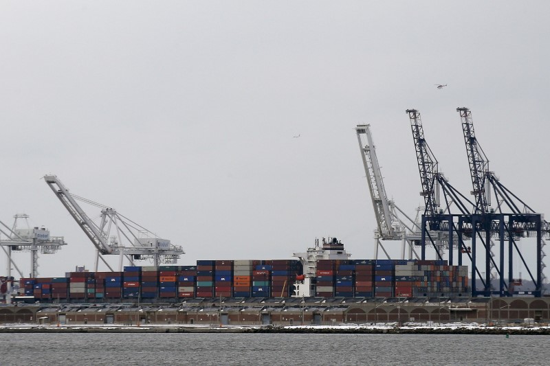 © Reuters. FILE PHOTO: Containers are stacked on a ship at the Port in Bayonne, New Jersey during a work stoppage in the harbor of New York