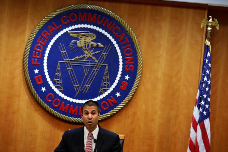 © Reuters. FILE PHOTO - Chairman Ajit Pai speaks ahead of the vote on the repeal of so called net neutrality rules at the Federal Communications Commission in Washington