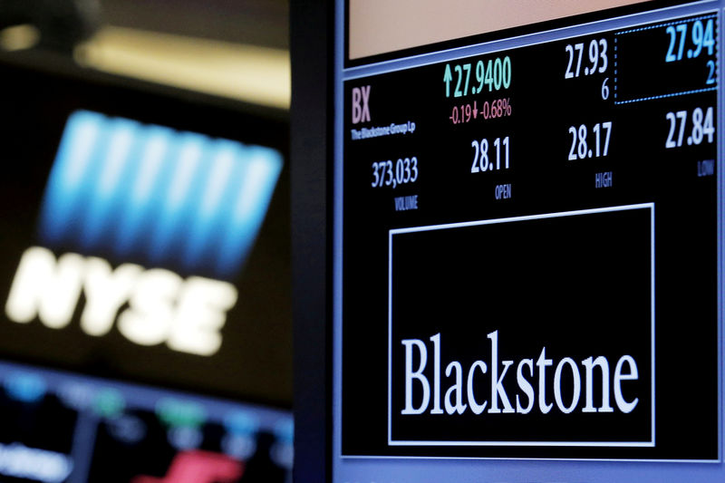 © Reuters. FILE PHOTO: The ticker and trading information for Blackstone Group is displayed at the post where it is traded on the floor of the New York Stock Exchange