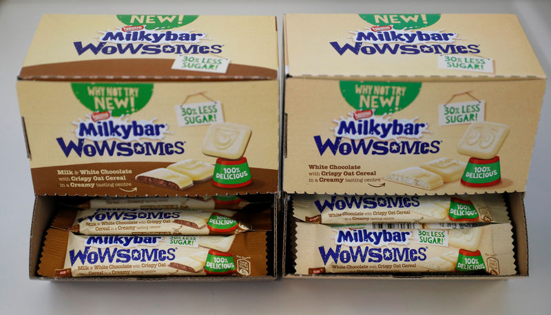 © Reuters. Bars of Nestle's new 'Milkybar Wowsomes' are displayed table at their Product Technology Centre in York