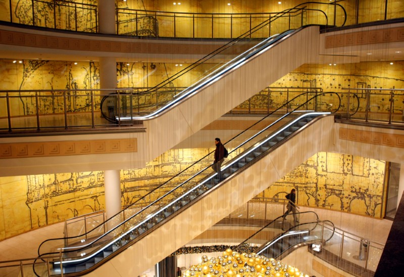 © Reuters. A customer uses the escalators in a shopping mall in Essen