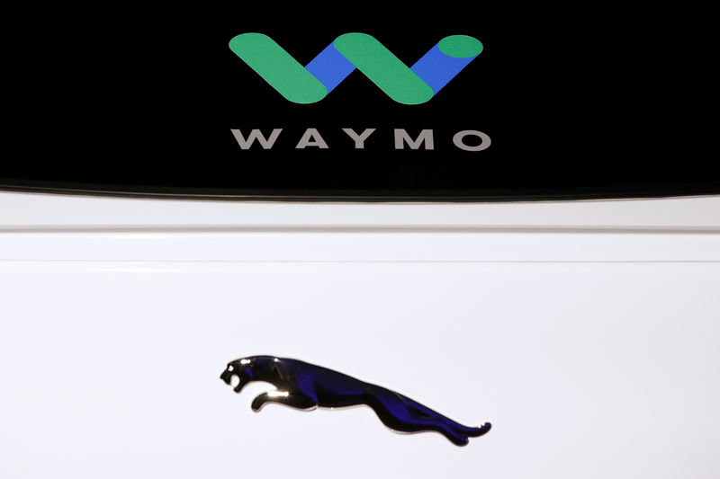 © Reuters. Logos of Jaguar and Waymo are seen at the is pictured during a Jaguar I-PACE self driving car unveiling event by Waymo in the Manhattan borough of New York City