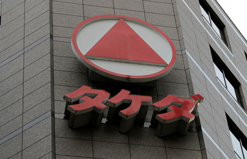 © Reuters. FILE PHOTO: Takeda Pharmaceutical's logo is seen on its headquarters building in Tokyo