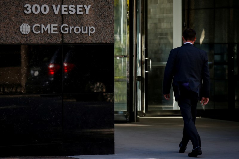 © Reuters. FILE PHOTO: A man enters the CME Group offices in New York