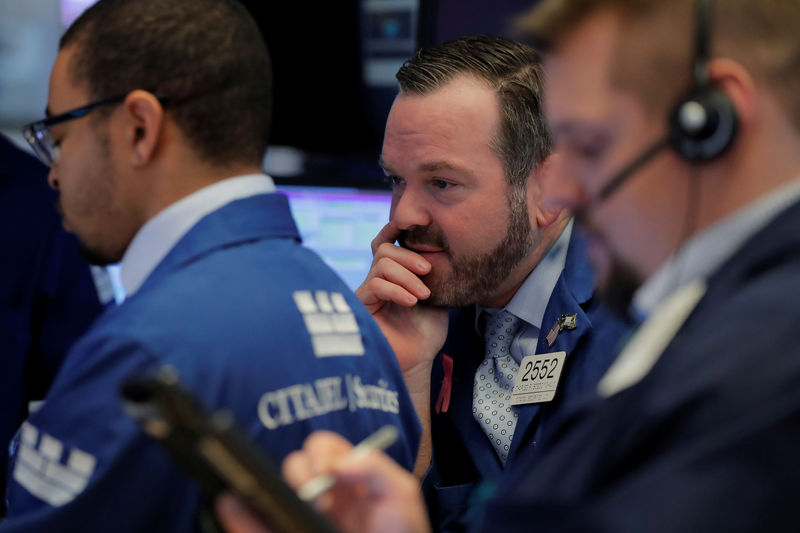 © Reuters. Traders work on the floor of the New York Stock Exchange shortly after the opening bell in New York